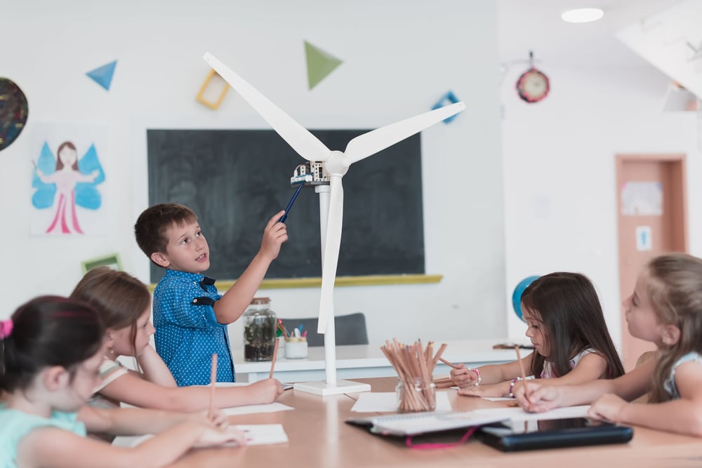 Children engaged in hands-on learning with technology — educational environment photography