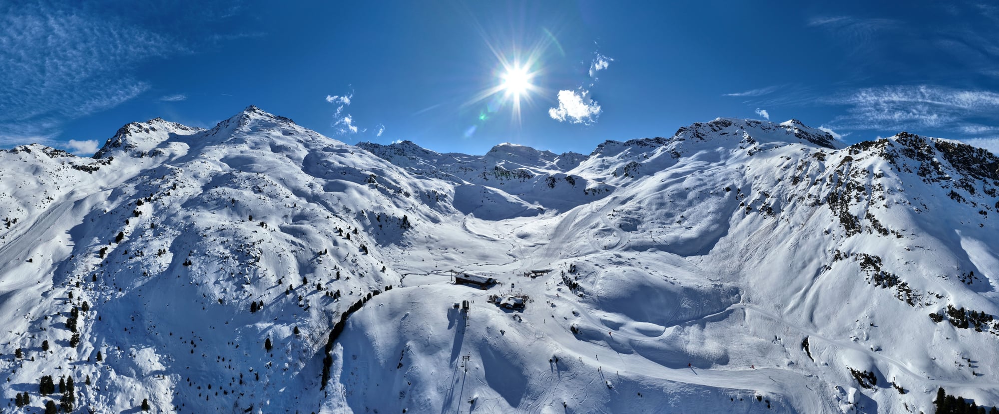 Aerial drone view of snow-covered mountain forest