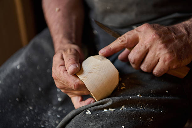Craftsman's hands carving a product by hand — product content photography